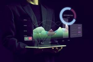 Dashboard Application on screen with businessman analytics data, charts and graphics photo