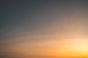 Scenic orange sunset sky background. digital lens flare. Background cloud summer. Cloud summer. Sky cloud clear. Natural sky beautiful yellow and white texture background. Cinematic photo