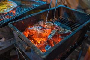 Close up Grilled girdle cake Banh Trang Nuong , a famous Vietnamese street stall eatery, a popular Vietnamese food in Da lat at night photo