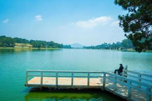 Fabulous sunrise by Xuan Huong Lake, in center Da Lat City, Lam Dong Province, Vietnam. This artificial lake in the city centre is a favourite place for tourists and locals for walking. photo