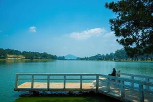 Fabulous sunrise by Xuan Huong Lake, in center Da Lat City, Lam Dong Province, Vietnam. This artificial lake in the city centre is a favourite place for tourists and locals for walking. photo