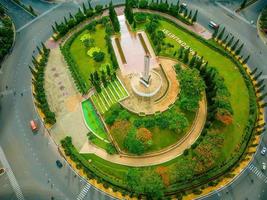 Vung Tau view from above, with traffic roundabout, house, Vietnam war memorial in Vietnam. This is the biggest roundabout in Vung Tau. photo