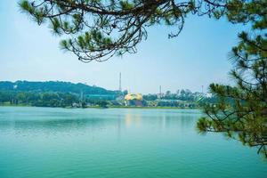 Fabulous sunrise by Xuan Huong Lake, in center Da Lat City, Lam Dong Province, Vietnam. This artificial lake in the city centre is a favourite place for tourists and locals for walking. photo
