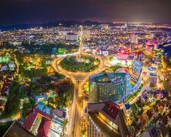 Panoramic coastal Vung Tau view from above, with traffic roundabout, house, Vietnam war memorial in Vietnam. Long exposure photography at night.