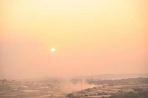 Amazing sunset landscape in agricultural greenhouse valley in Da Lat City. The light from the greenhouse to grow flowers in Da Lat. Travel and landscape concept photo