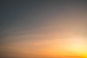 Scenic orange sunset sky background. digital lens flare. Background cloud summer. Cloud summer. Sky cloud clear. Natural sky beautiful yellow and white texture background. Cinematic photo