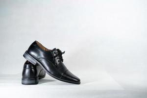 Luxuary man leather black shoe on the white isolation backtground.