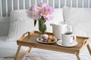 Tray with breakfast on bed. photo