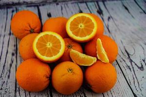 A stack of fresh sliced orange fruits photo