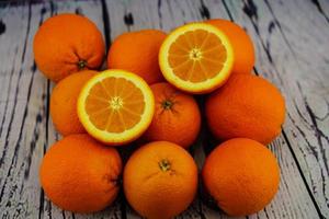 A stack of fresh sliced orange fruits photo