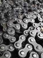 Abstract background texture of old and dirty roller chain for motorcycle photo