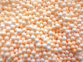 Background of white circle styrofoam ball pattern texture foam surface abstract background photo