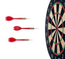 red dart arrows flying to target dartboard. Metaphor to target success, winner concept. Isolated on white background photo