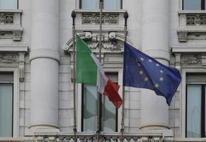 The flag of Italy and the flag of the EU in the wind in Florence, Italy photo