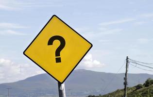 Yellow road sign with a question mark photo