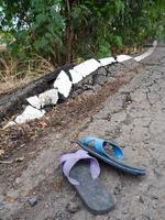 Old shoes on the asphalt. photo