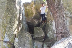 Man on a rocky crevice. photo