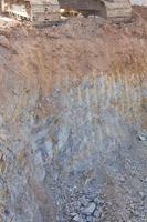 Caterpillar backhoe on the cliffs. photo