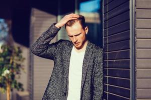 stylish man posing in autumn coat photo