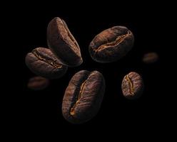 Coffee beans levitate on a black background photo