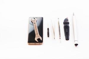 Flat lay image of dismantling the broken smart phone for preparing to repair or replace some components. isolated photo