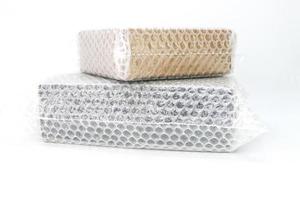 Bubbles covering the box by bubble wrap for protection product cracked white background photo