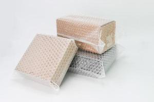 Bubbles covering the box by bubble wrap for protection product photo
