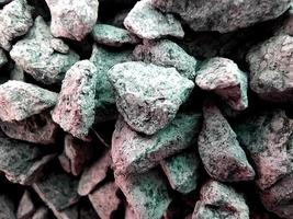Macro image of crushed stone. Background of gray-green patterned texture of crushed stone. photo