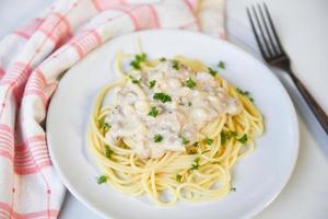 Spaghetti italian pasta served on white plate with parsley in the restaurant italian food and menu concept - Spaghetti carbonara photo