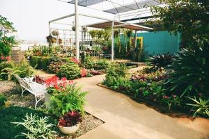 Home gardening and decorating indoor greenhouse environments setups flowers and plants - Relaxing in beautiful garden with Chairs home exterior photo