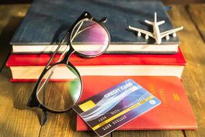 Credit card put on passport on wooden desk photo