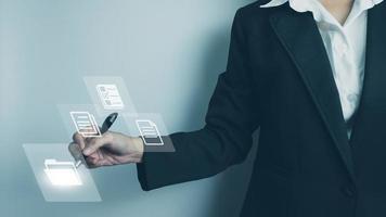 Business woman using touch screen folder manage file,online data management,Document Management System DMS,access to document file with security,structure design document,ERP enterprise photo
