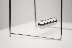 A close-up angle shot of the Newton's cradle. photo