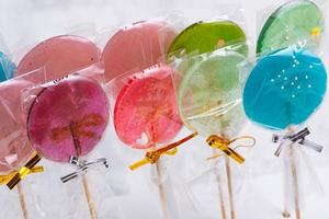 Colorful lollipops on a blurred background photo