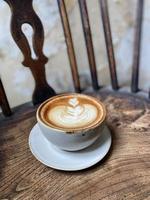 Hot coffee cup on table photo