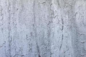 Textured of plastered cement wall is uneven is design and concept for background. photo