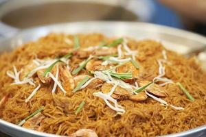 Close up of Fried noodle Thai style with prawns, thai street food market photo