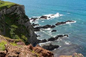 Wild rocky coast near Thurlestone in Devon photo