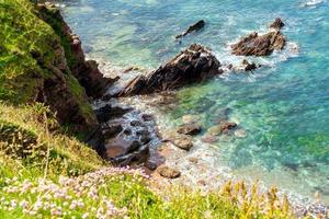 Rocks in the sea near Outer Hope in Devon photo