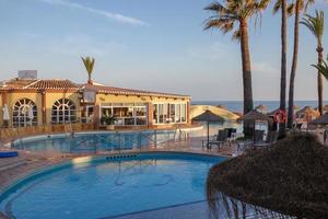 CALAHONDA, ANDALUCIA, SPAIN, 2014. Evening sunshine at Dona Lola holiday resort in Calahonda Spain on May 8, 2014. Unidentified people. photo