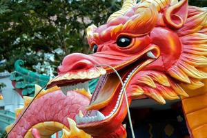 Singapore, 2012. Plastic Model of a Dragon in a Singapore Street photo