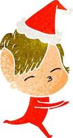 retro cartoon of a girl in onesie wearing santa hat vector