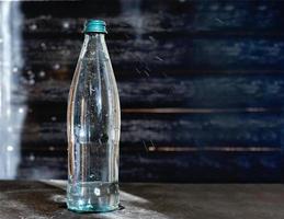 a bottle of mineral water on grey table. photo