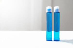 blue cosmetic liquid in plastic bottles. photo