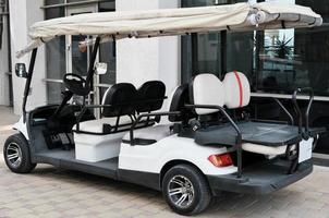 Electric buggy near hotel building. photo