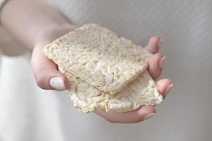 girl holding Puffed rice bread photo