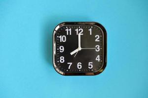 alarm clock on yellow background. photo