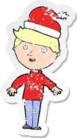 retro distressed sticker of a cartoon boy in santa hat vector