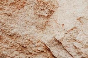 detalles de textura de piedra arenisca con tinte naranja foto
