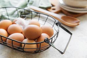 Basket of fresh brown eggs photo